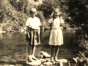 Two girls in front of Maitai River